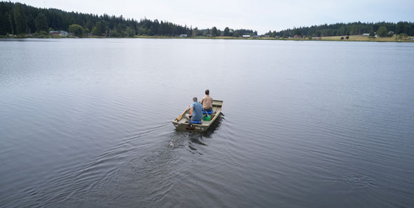 Mark Sytsma and Matt Zupich in a boat on Lone Lake